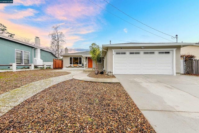 ranch-style home featuring a garage