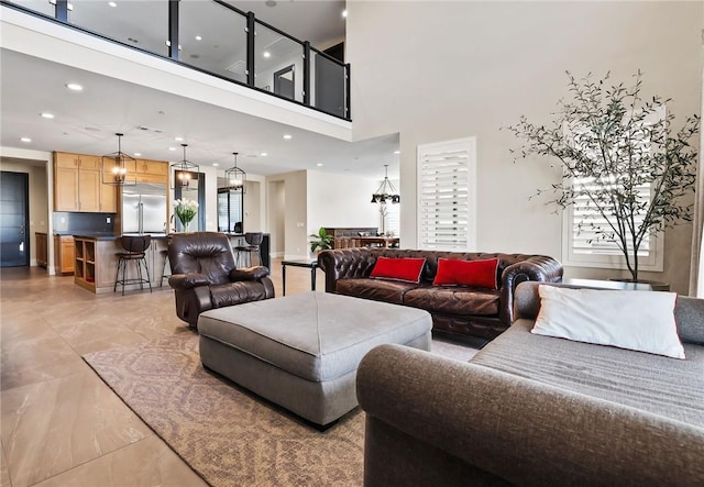 living room featuring a high ceiling