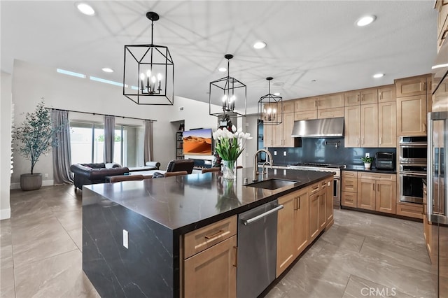 39767 Larkspur Ter, Temecula, CA 92591 - kitchen with stainless steel appliances, under cabinet range hood, dark countertops, a chandelier, and recessed lighting