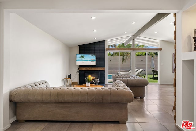 tiled living room with vaulted ceiling with beams and a fireplace