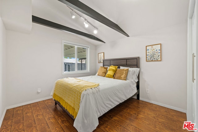 bedroom with dark hardwood / wood-style floors, lofted ceiling with beams, and rail lighting