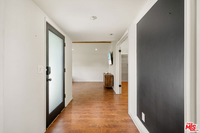 hallway featuring light hardwood / wood-style flooring