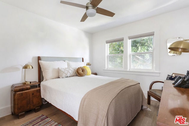 bedroom featuring ceiling fan and dark hardwood / wood-style flooring