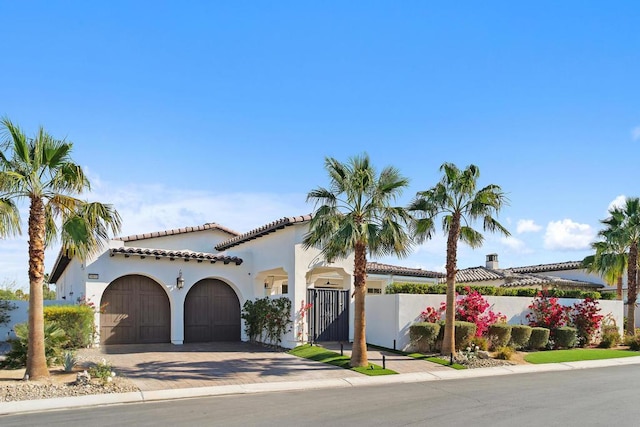 mediterranean / spanish-style house featuring a garage