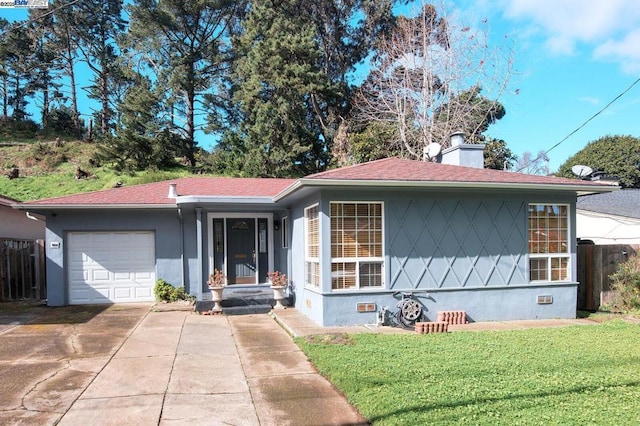 ranch-style house featuring a garage and a front yard