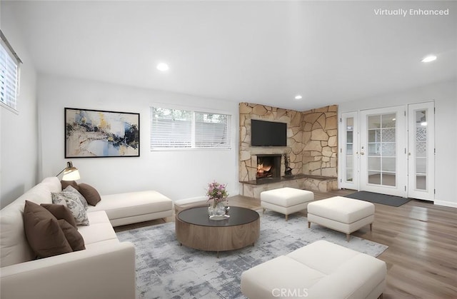 living room featuring a fireplace and hardwood / wood-style floors