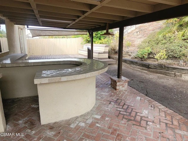 view of patio featuring an outdoor kitchen