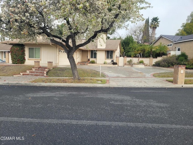 ranch-style house featuring a garage