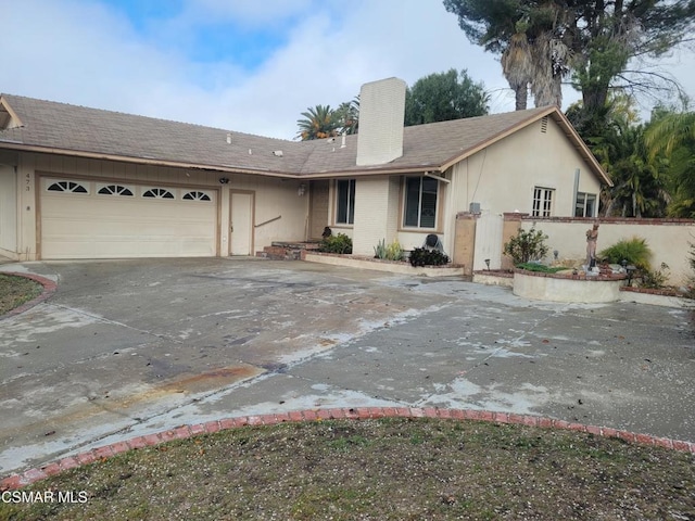 single story home featuring a garage