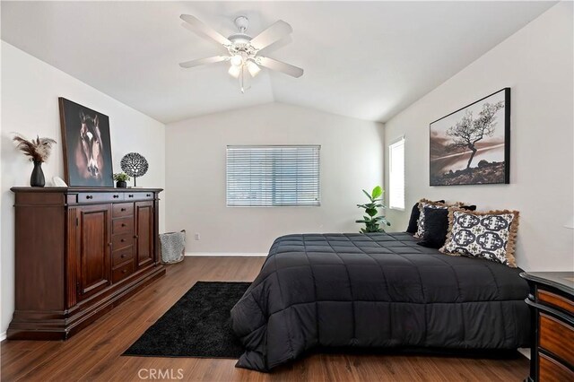 bedroom featuring hardwood / wood-style flooring, ceiling fan, and lofted ceiling