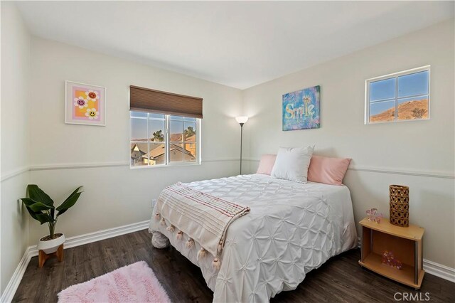 bedroom featuring dark wood-type flooring