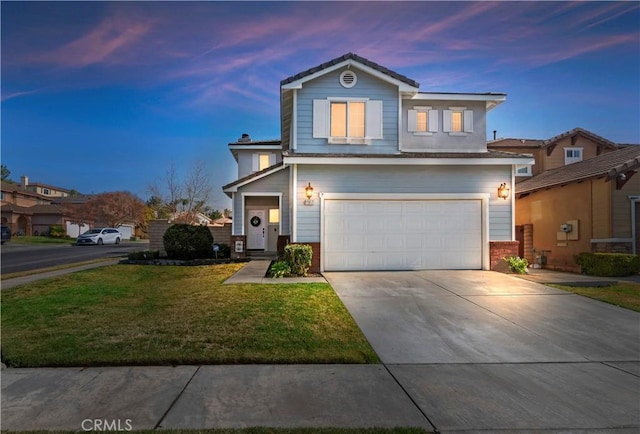 view of front property with a garage and a lawn