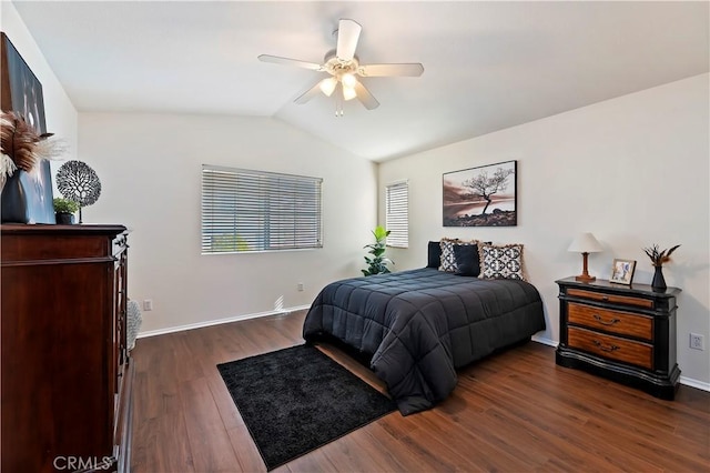 bedroom with dark hardwood / wood-style flooring, lofted ceiling, and ceiling fan