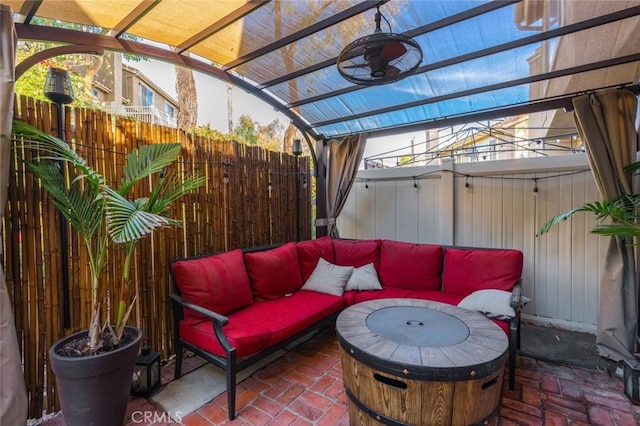 view of patio / terrace with an outdoor hangout area, ceiling fan, and a pergola