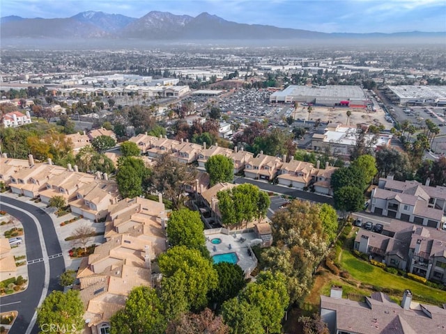 birds eye view of property featuring a mountain view