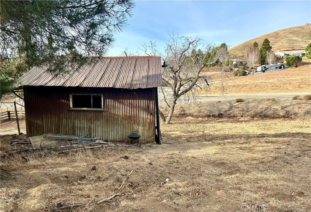 view of outbuilding with a mountain view