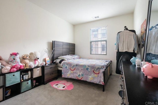 bedroom featuring light carpet