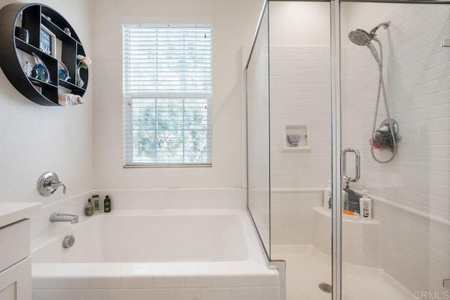 bathroom with vanity and plus walk in shower