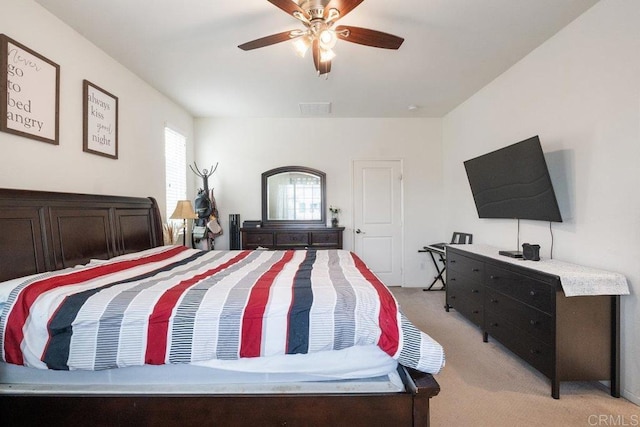 bedroom with ceiling fan and light colored carpet