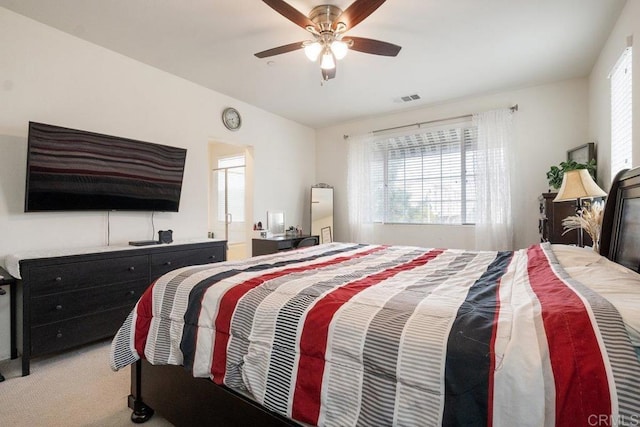 bedroom featuring ceiling fan, lofted ceiling, and carpet