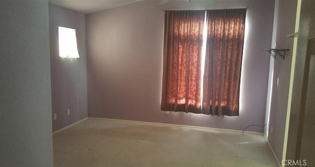 spare room featuring carpet flooring