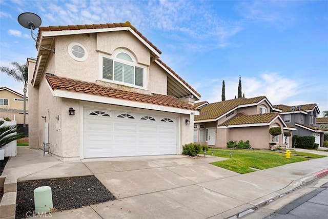 view of front facade featuring a garage and a front yard