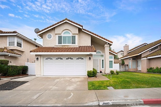 view of front of property featuring a garage and a front yard