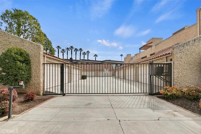 view of gate with fence