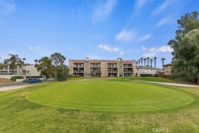 surrounding community with view of golf course