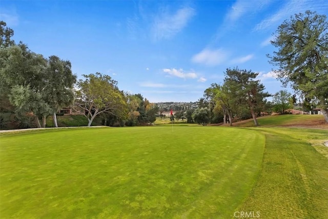 view of property's community with view of golf course