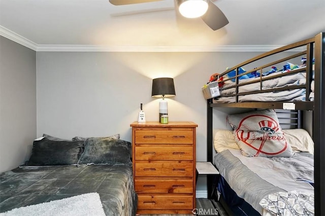 bedroom featuring ornamental molding and ceiling fan