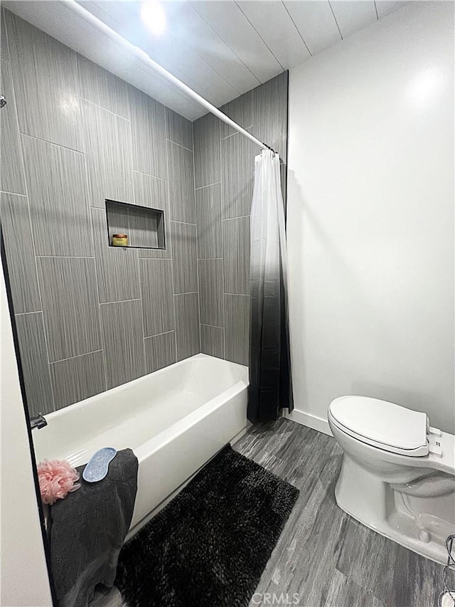 bathroom with wood-type flooring and toilet