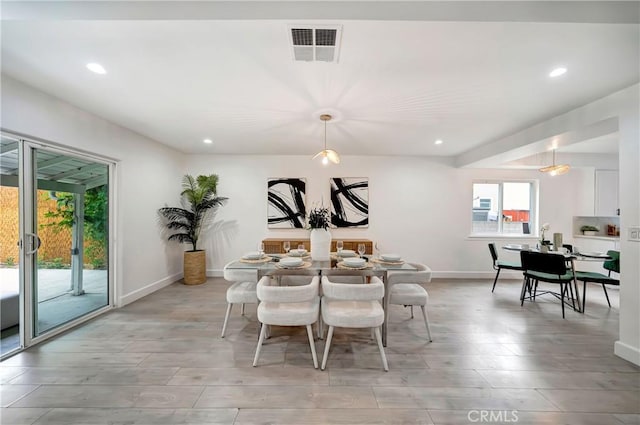 dining area featuring light wood-type flooring