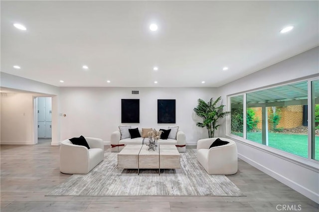 living room with light hardwood / wood-style flooring