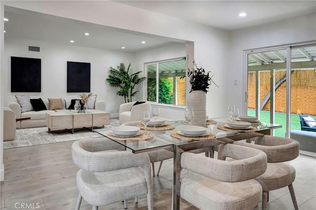 dining space featuring light wood-type flooring