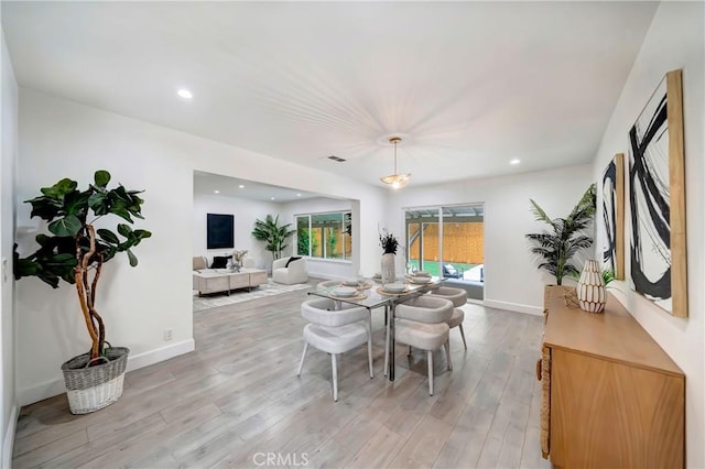 dining room with light wood-type flooring