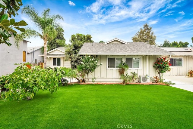 single story home featuring ac unit and a front lawn