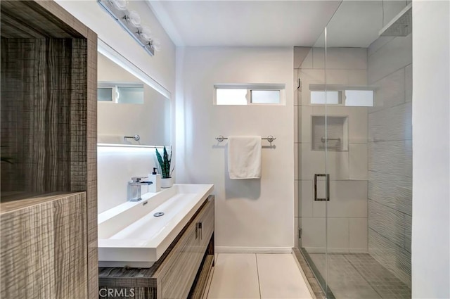 bathroom with vanity, tile patterned flooring, and a shower with door