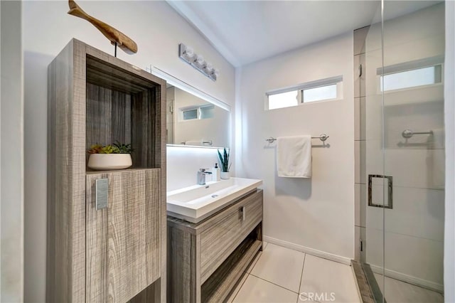 bathroom with vanity, an enclosed shower, and tile patterned flooring