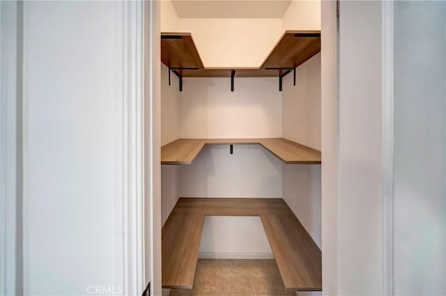 spacious closet with built in desk