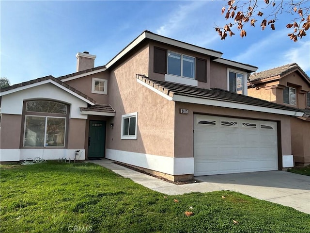 view of property with a garage and a front lawn