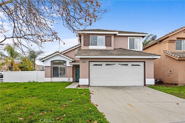 view of front of house featuring driveway, fence, a front lawn, and stucco siding