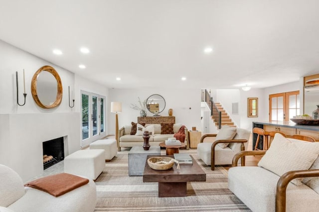 living room with a healthy amount of sunlight and french doors