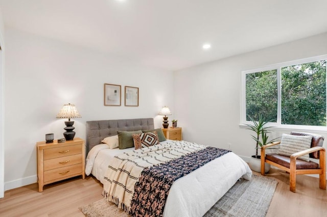 bedroom with light hardwood / wood-style flooring