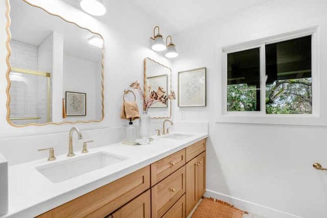 bathroom with vanity and a shower with shower door