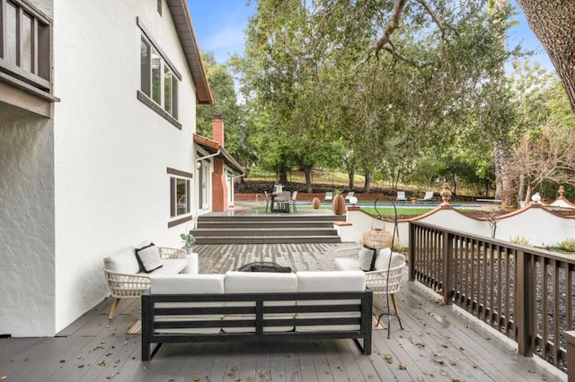 wooden deck with outdoor lounge area