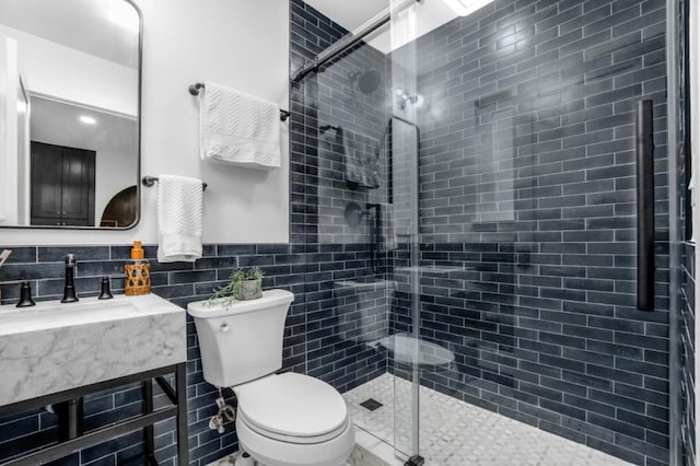 bathroom featuring toilet and walk in shower