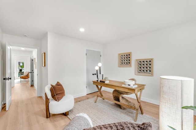 office area with light hardwood / wood-style floors