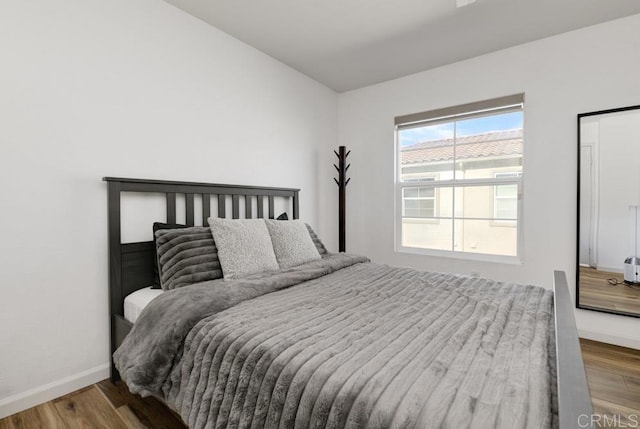 bedroom with light hardwood / wood-style flooring