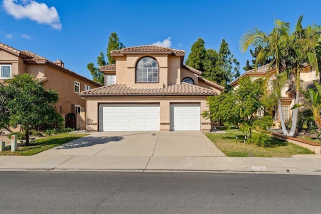 mediterranean / spanish-style home featuring a garage